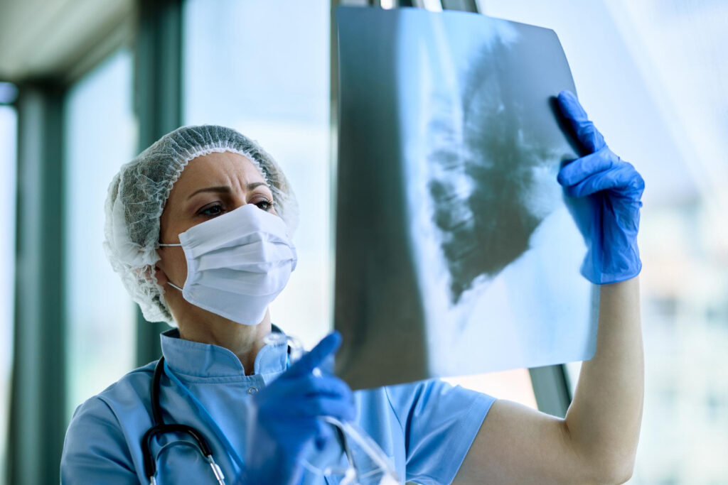 female radiologist analyzing chest xray patient medical clinic during coronavirus epidemic